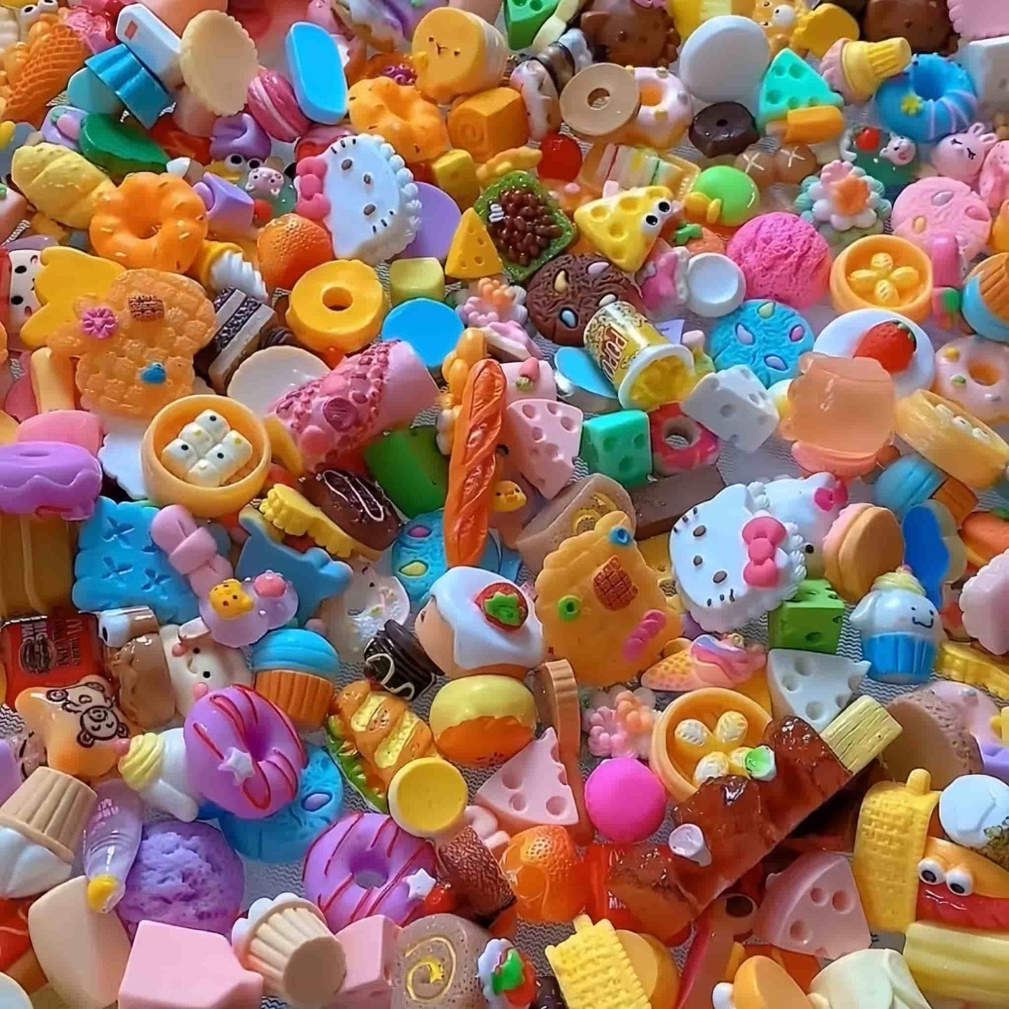 Close-up of premium resin food charms with vibrant multicolor mix, smooth texture