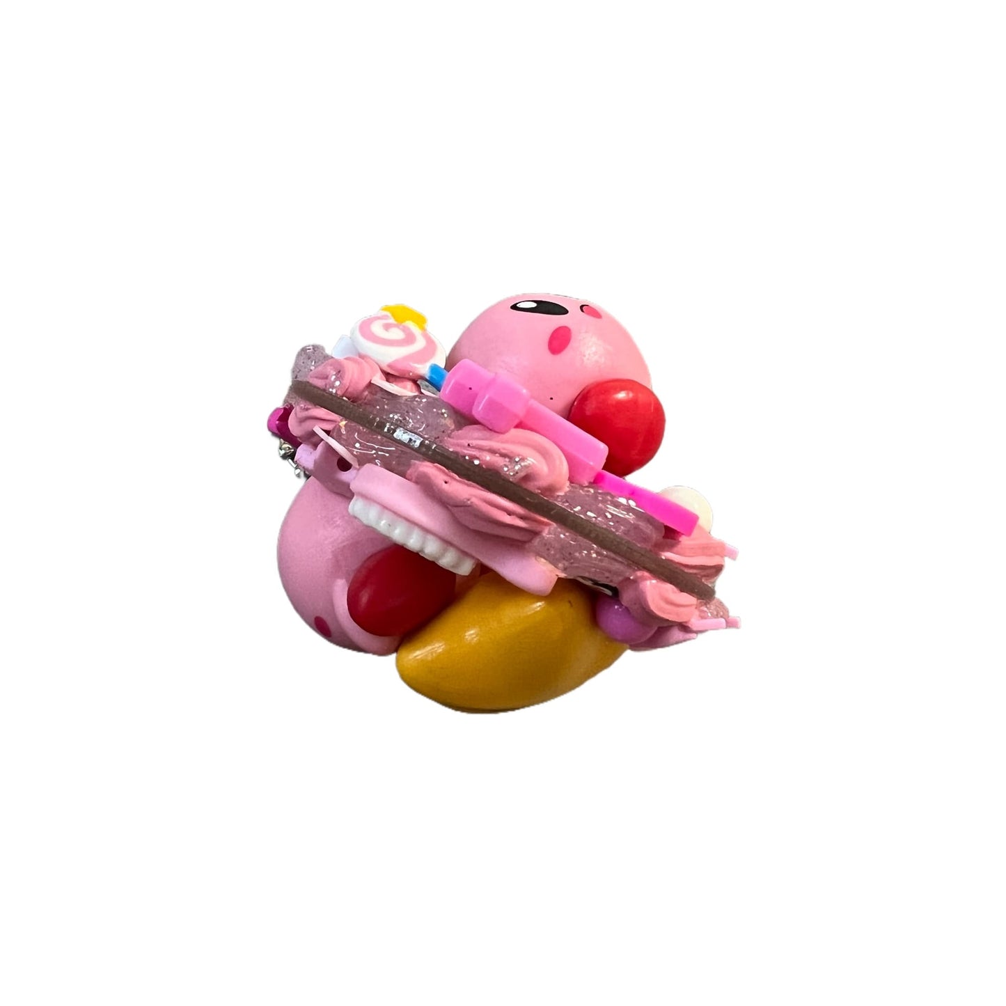 Close-up of Kirby decoden pendant showing intricate handmade baroque cream glue craftsmanship