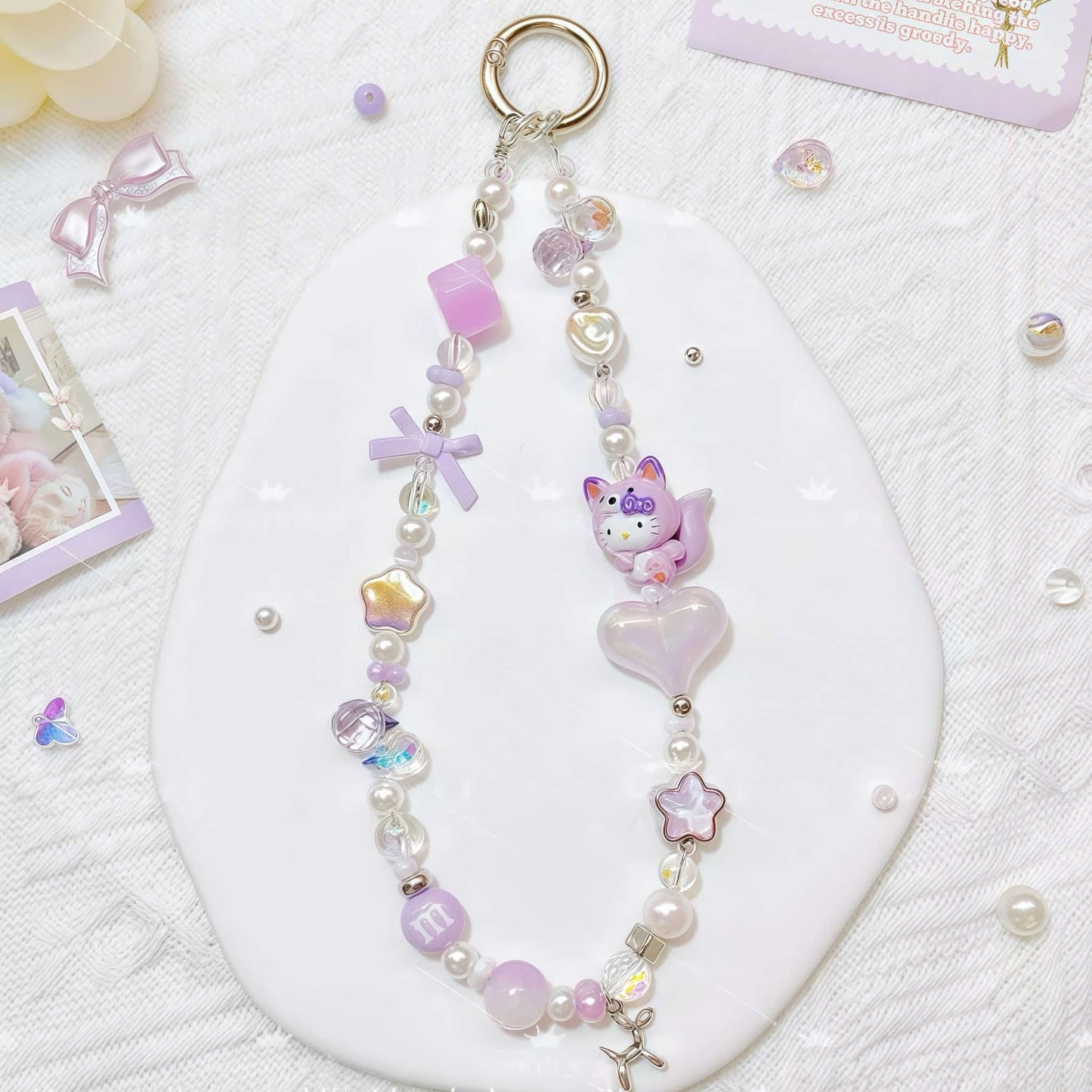 Handmade purple crystal phone chain with Sanrio character charm - Y2K kawaii strap