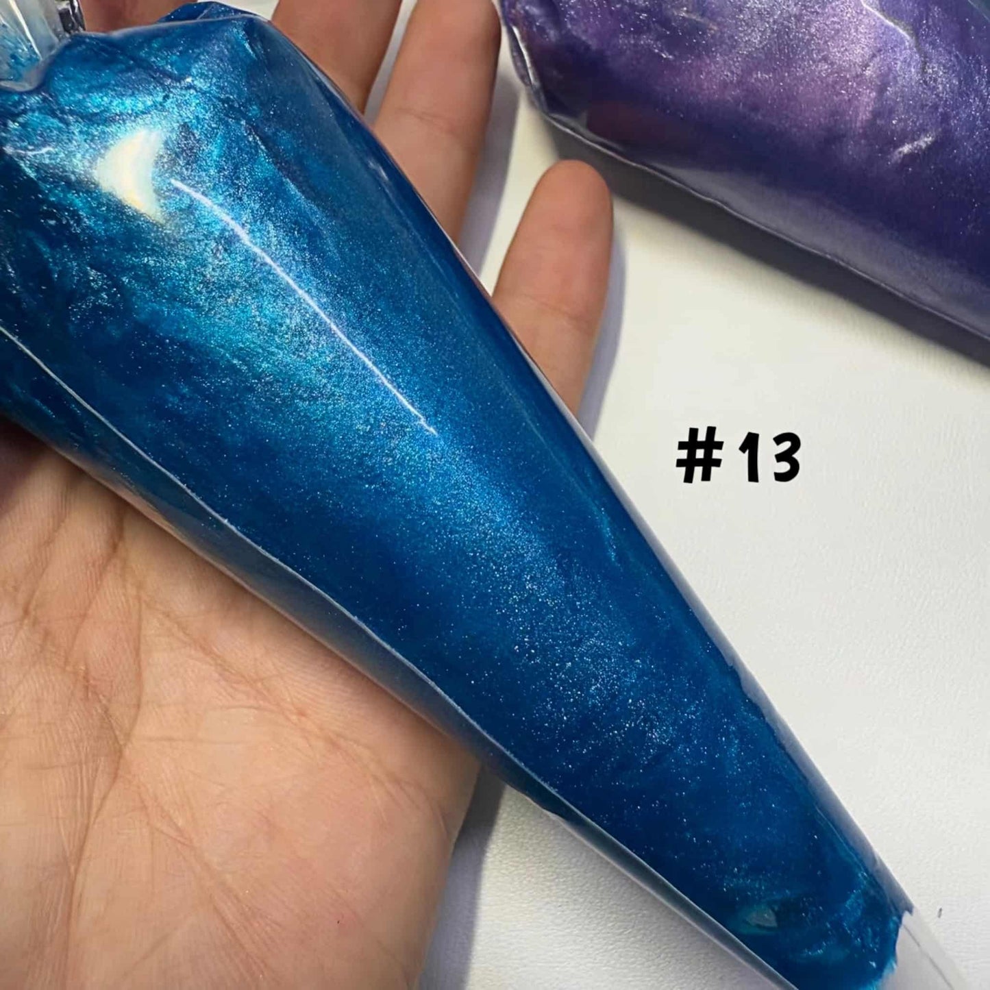 Blue pearlescent cream adhesive with piping tip for kawaii DIY crafts and accessories