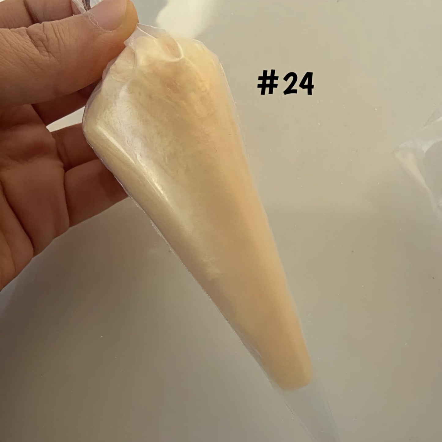 Pearlized craft adhesive perfect for baroque and Y2K aesthetics