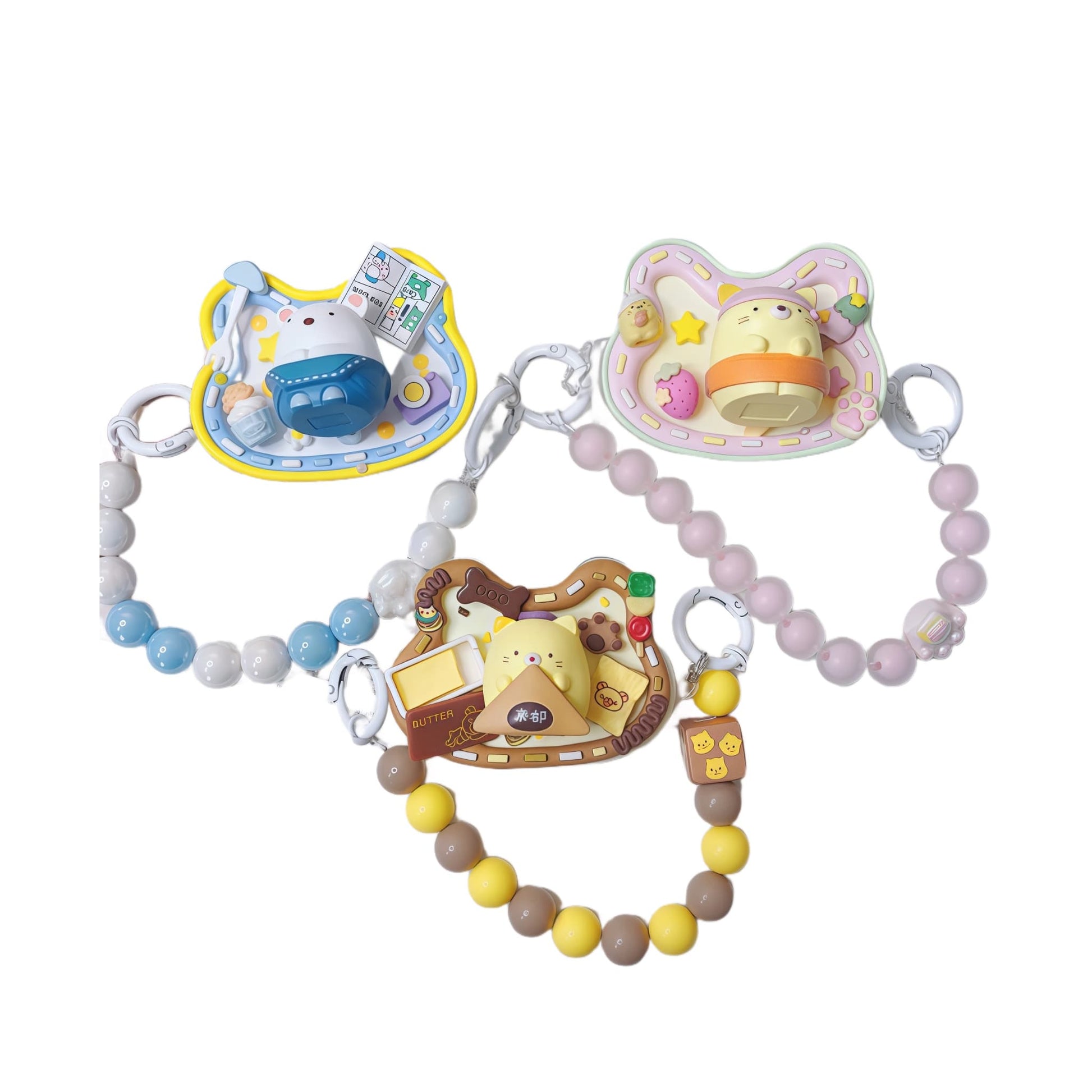 Handmade decoden phone back clip featuring Sumikko Gurashi characters with baroque-style pearl and rhinestone embellishments and beaded wrist strap