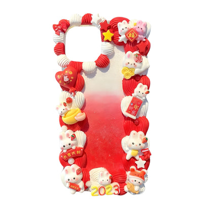 Red cream glue decoden phone case with kawaii charm decorations, gift-ready presentation in Baroque Y2K style