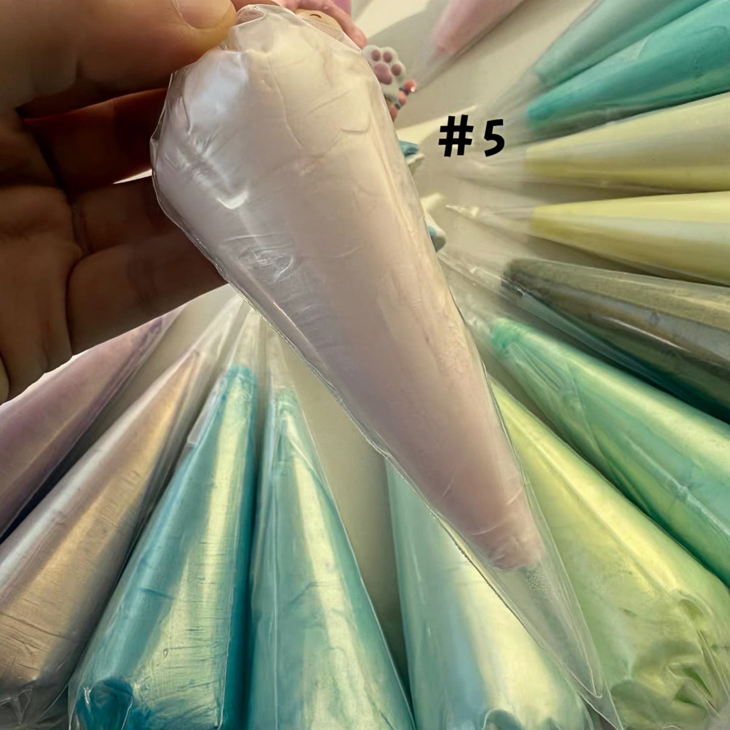 Decoden cream glue in rainbow colors with professional piping nozzles