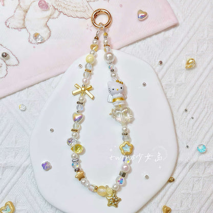Handmade golden Hello Kitty phone chain with baroque pearl embellishments