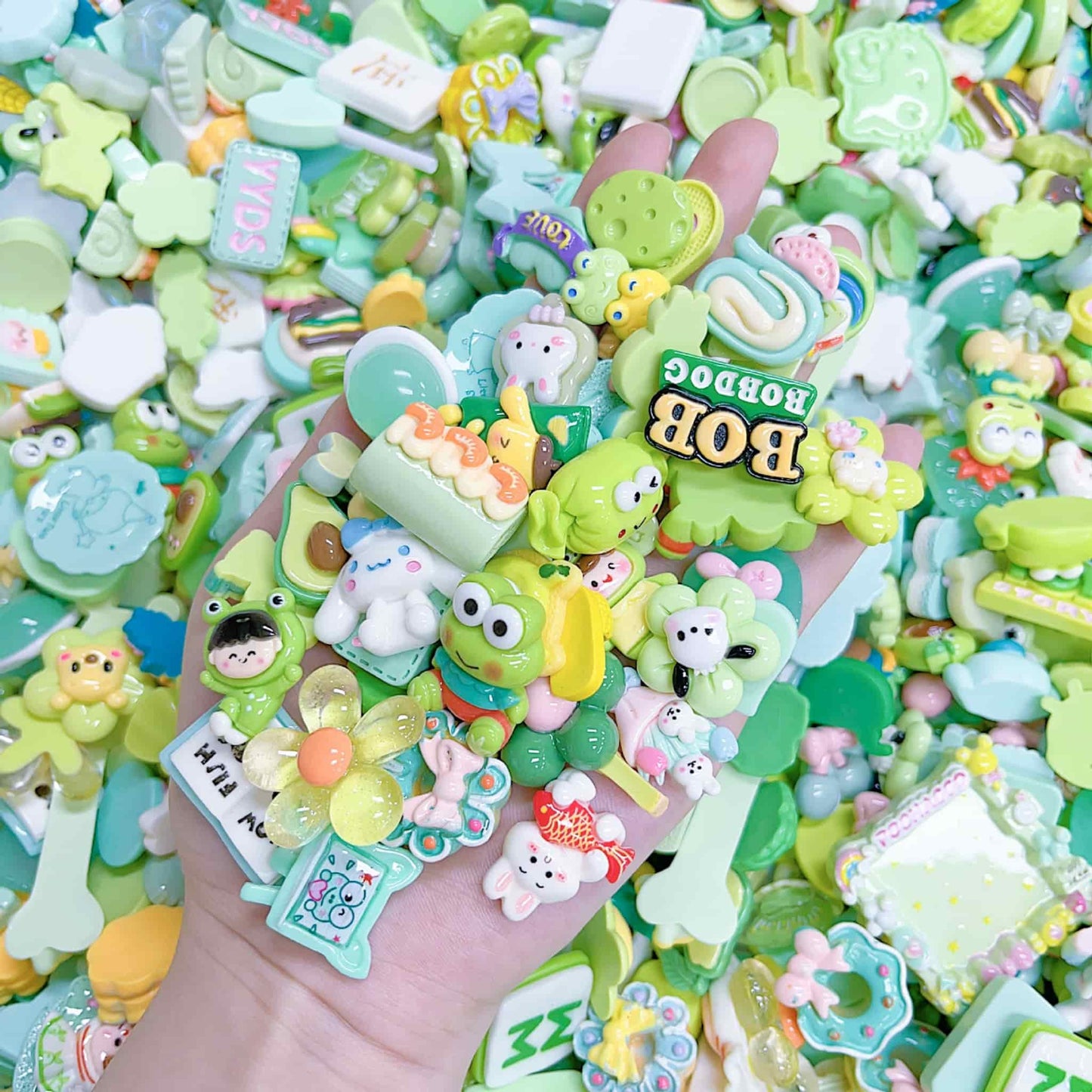 Assorted multicolor resin charms including cute cartoon designs perfect for phone case decoration and craft projects