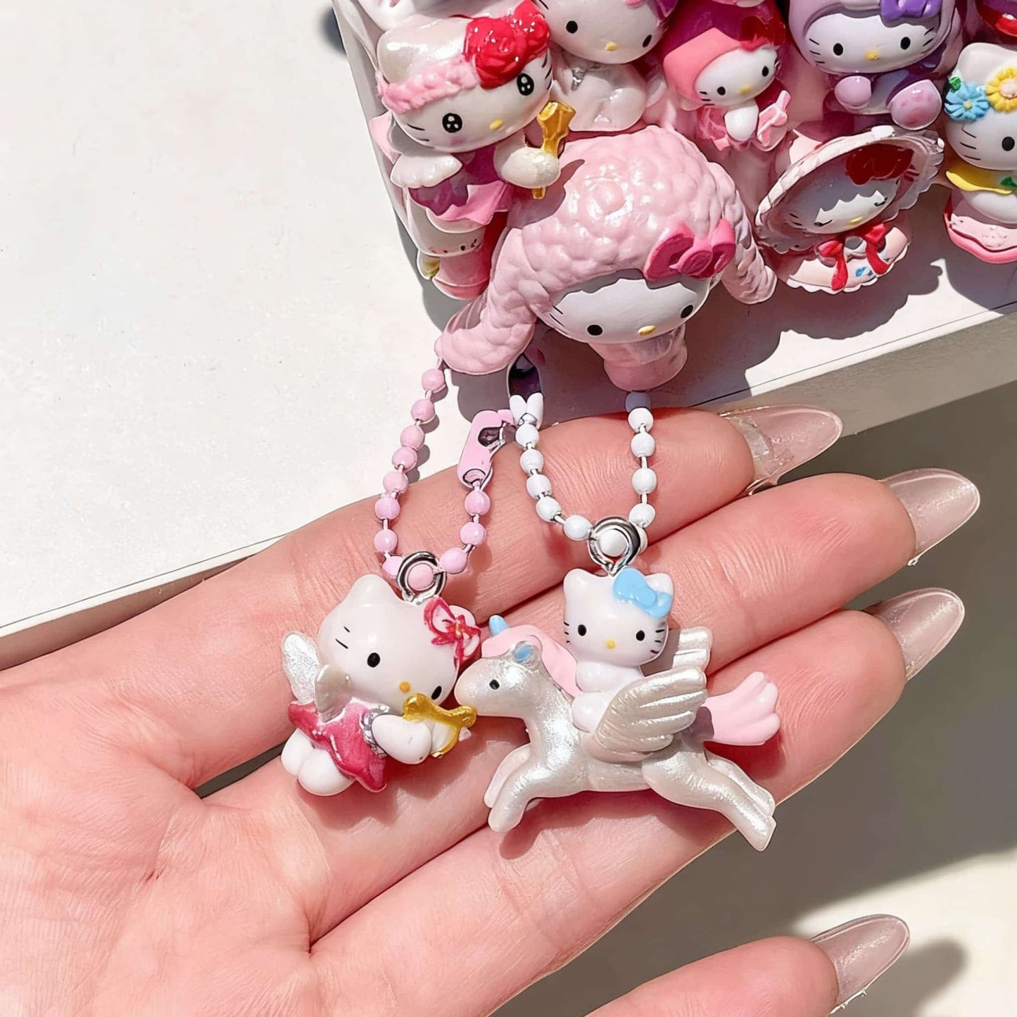 Hello Kitty phone charm detail, handcrafted decoden decoration with luxury Sanrio character embellishments