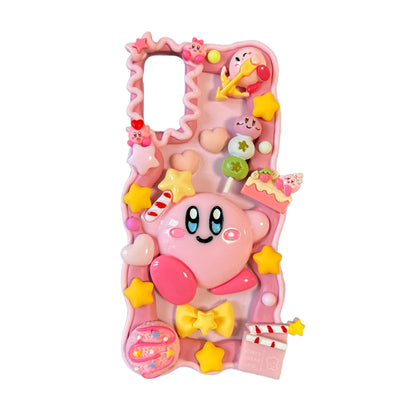 Handmade kawaii Kirby decoden phone case with baroque-inspired cream glue design and pink pearl embellishments