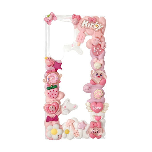 Handmade decoden phone case featuring pink Kirby character design with cream glue embellishments, Baroque and Y2K aesthetic styling