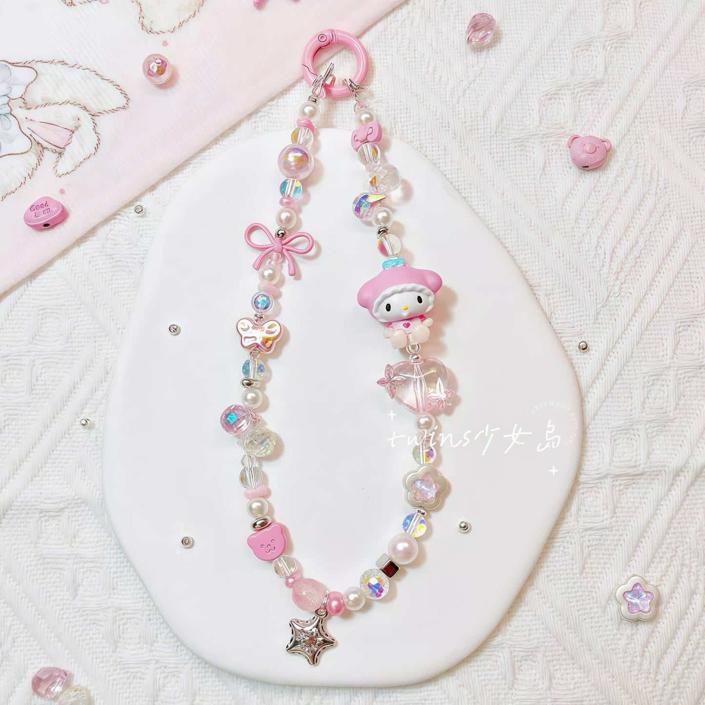 Handmade piano-themed phone chain with Sanrio character charm