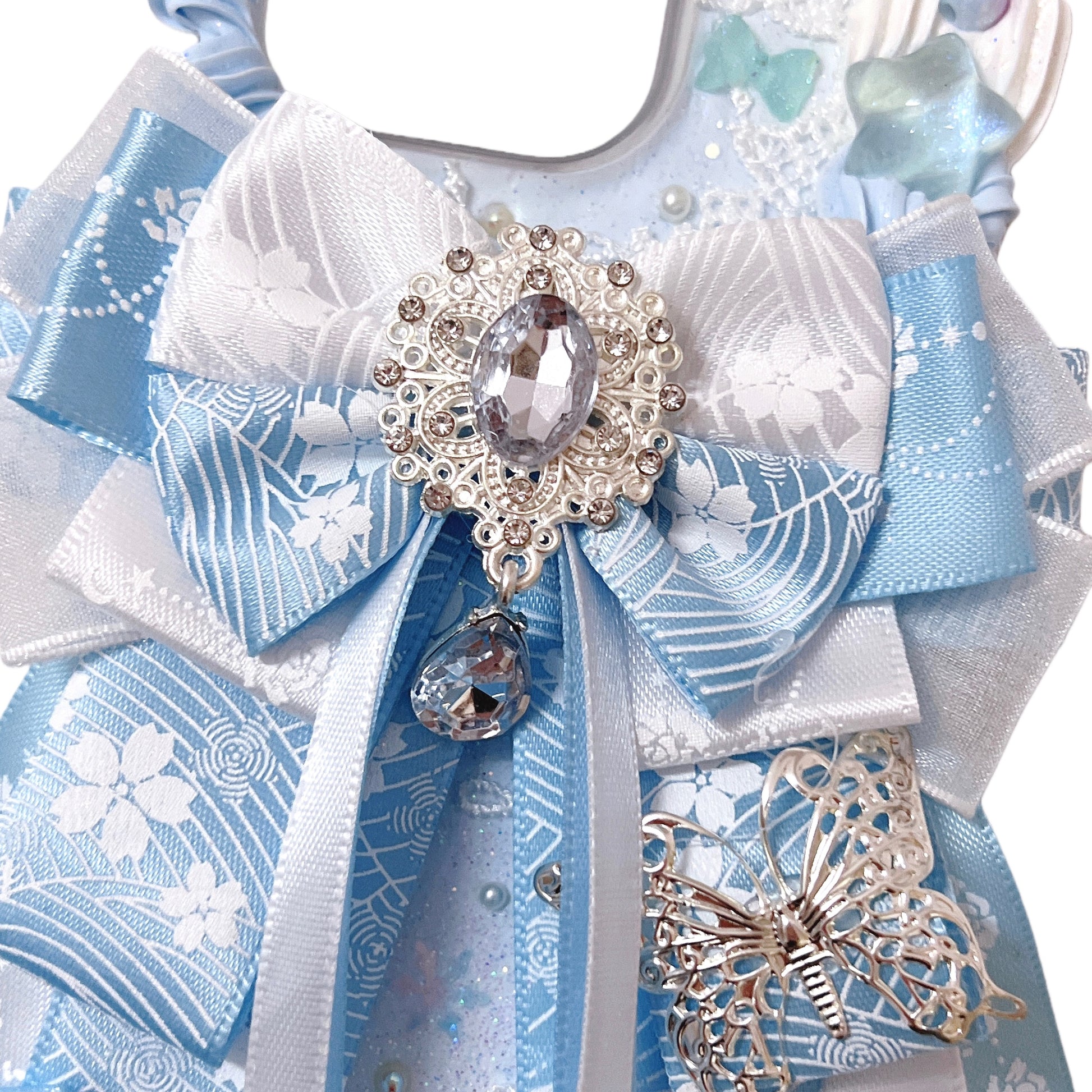 Custom baroque decoden phone case in blue with Y2K style angel and pearl decorations 